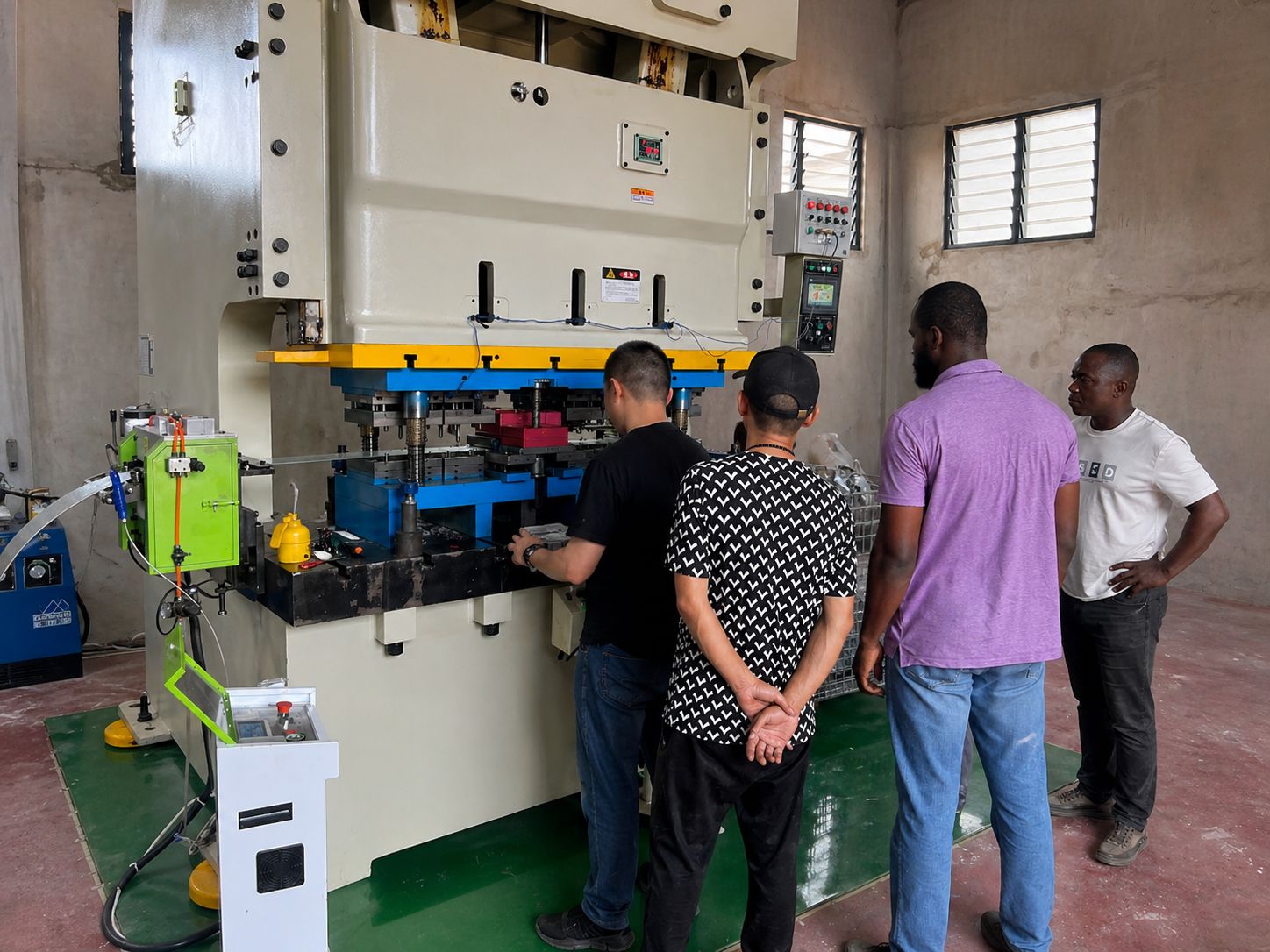 Alooh Electricals factory — New Orient punch press in operation, Tema Ghana